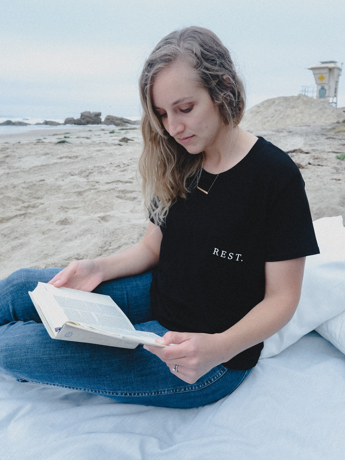 Rejoice & Do Good Christian Apparel - Women's Black Pocket T-shirt Tee with the words Rest on the pocket based on Genesis and the 7th day of rest